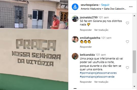 Publicação do instagram com imagem da fachada de uma praça com o nome Praça Nossa Senhora da Vitória gravado no muro. Nos comentários dizem: Usuário: josivaldo2799 Texto: só faz em Goiana, pq nos distritos nada Usuário: bellcandida Texto: uma praça que infelizmente só vai poder ser usufruída a noite, porque durante o dia não tem se quer uma sombra. #pormaisprojetoscomarvores #pormaisprojetoscomverde