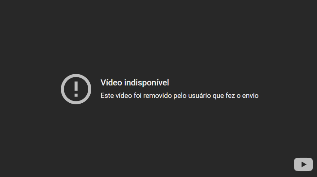 A imagem mostra uma tela escura com um ícone circular contendo um ponto de exclamação. No centro, aparece uma mensagem em português informando que o vídeo não está disponível porque foi removido pelo próprio usuário que o havia publicado.