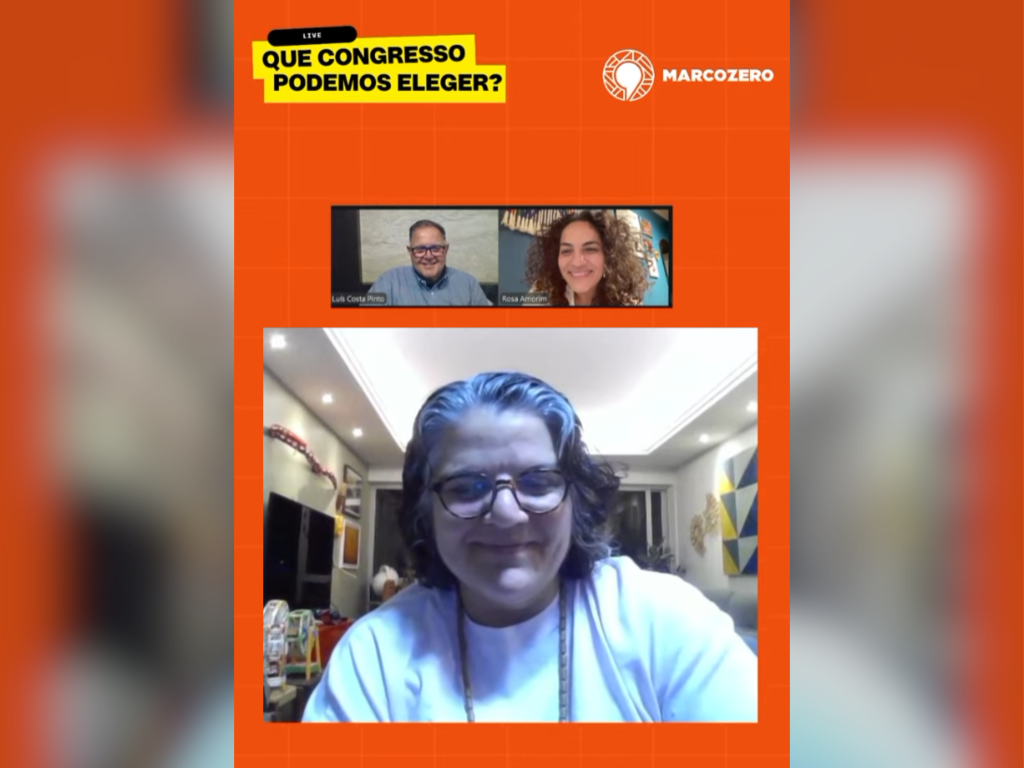A imagem mostra uma transmissão online com fundo laranja e o título “Que Congresso Podemos Eleger?”. Três participantes aparecem em vídeo: Luis Costa Pinto, Rosa Amorim e Carol Monteiro. O logotipo “Marco Zero” está visível no canto superior direito.