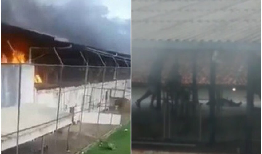 A colagem mostra duas cenas de um possível incidente em uma unidade prisional. À esquerda, há um prédio cercado por arame farpado com chamas intensas e fumaça escura saindo do telhado, indicando um incêndio. À direita, vê-se uma área coberta onde algumas pessoas aparecem em meio à fumaça, com uma figura caída no chão, sugerindo uma situação de emergência ou conflito. As imagens transmitem um clima de tensão e perigo, com forte contraste entre fogo e sombra.
